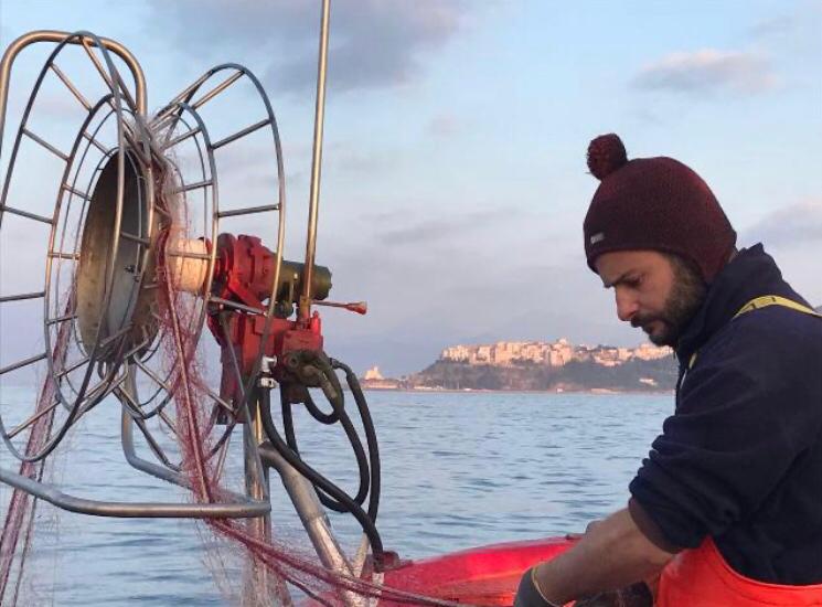 Fisherman on his boat in Sperlonga