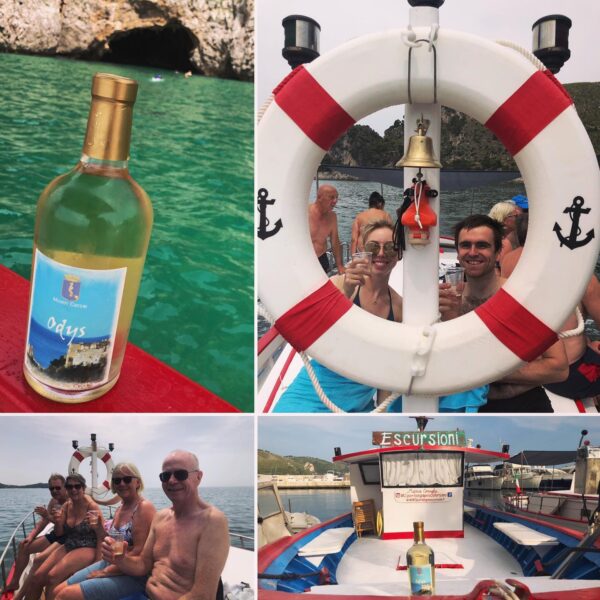 A group of people on a boat tour in Sperlonga with wine