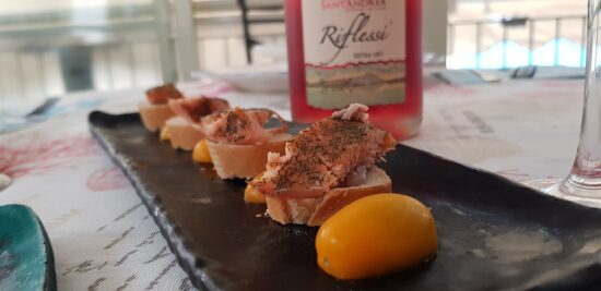 Fish appetizers and a bottle of rosé wine